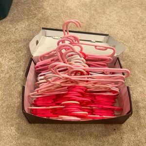 50 baby /toddler hangers.  Pink and white.